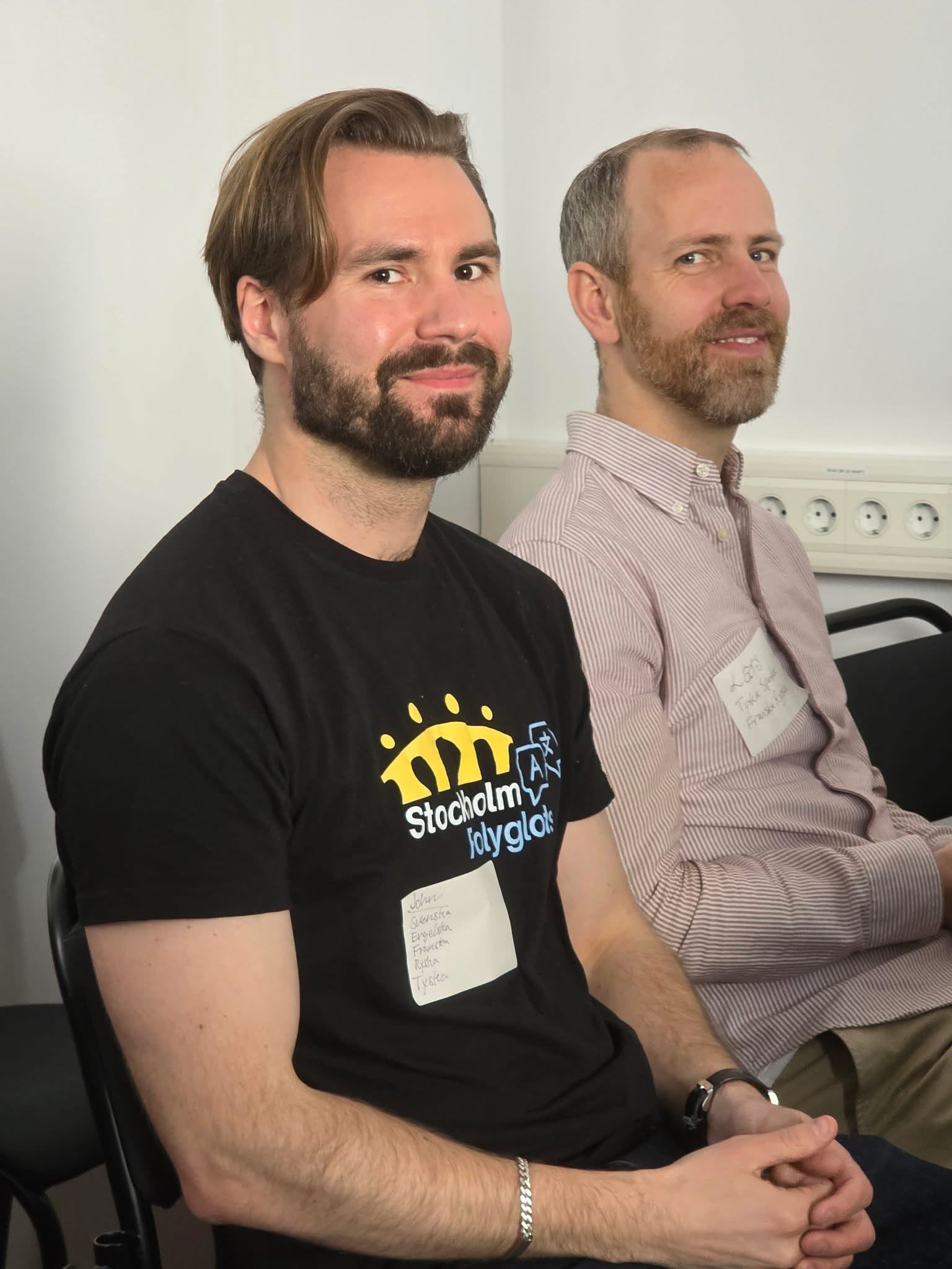 Stockholm Polyglots members with language name tags at an event