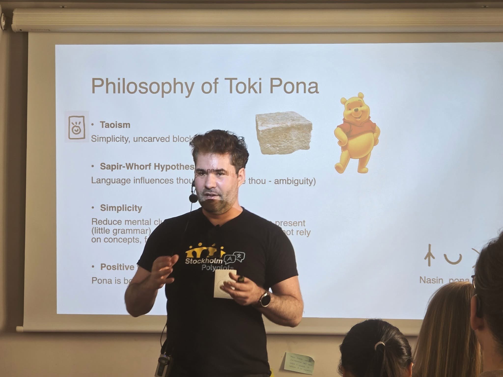 A Stockholm Polyglots member giving a talk on the philosophy of Toki Pona